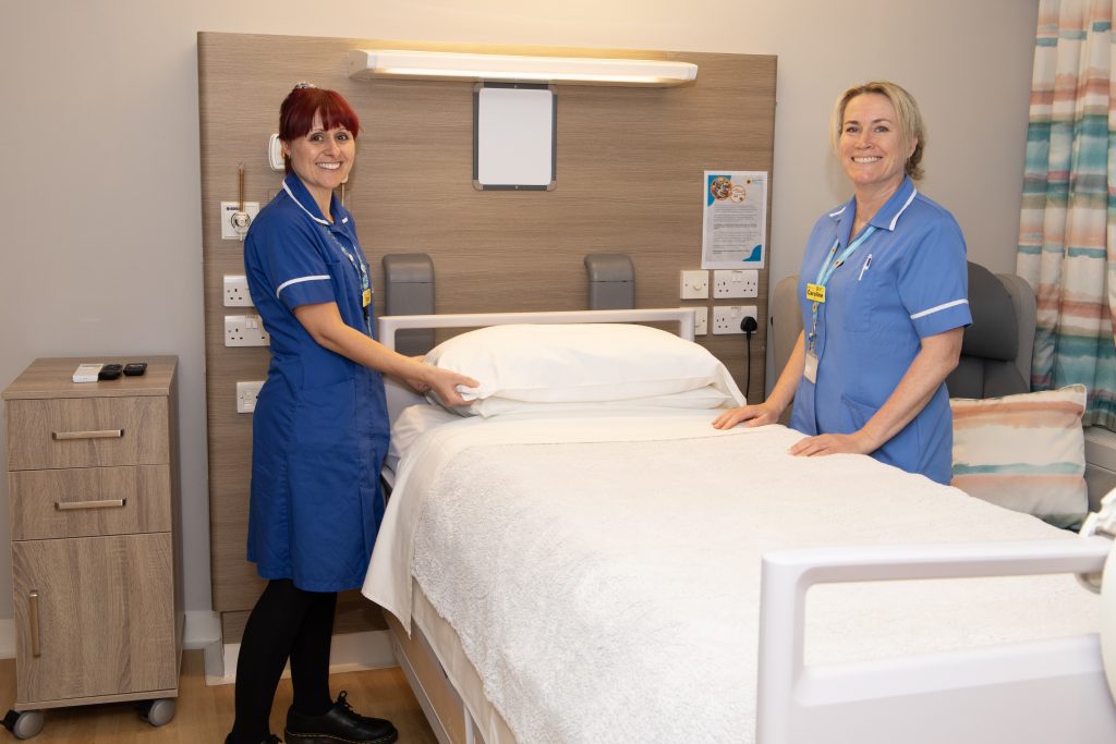 Staff nurse Carly Forrester (left) and healthcare assistant Caroline Allen stood by a Hospice bed in one of the Inpatient rooms.