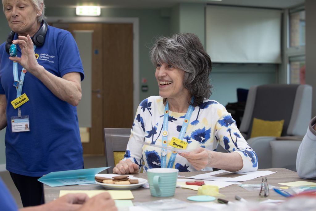 A Sunflwoer Living Well Centre volunteer taking part in a session at East Cheshire Hospice.