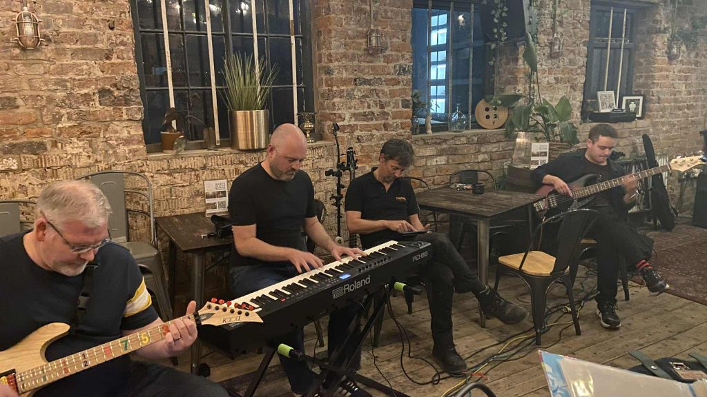Group of musicians from Hospice Aid practicing their performance