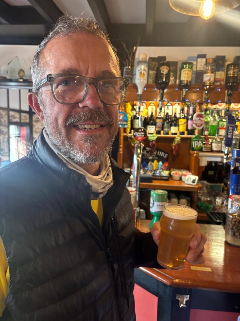 Walker Simon Frith enjoys a free half pint at The Border Hotel after his walk