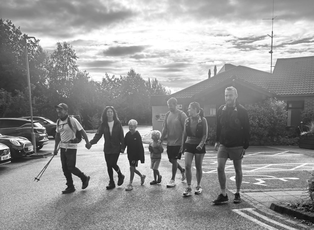 Simon and Becky are joined by family members as they leave the Hospice.