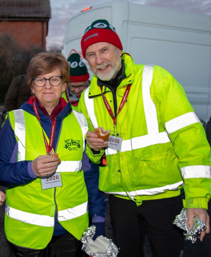 Neil McArthur and wife Francesca pose in hi-vis clothing at the Christmas Tree Collection.