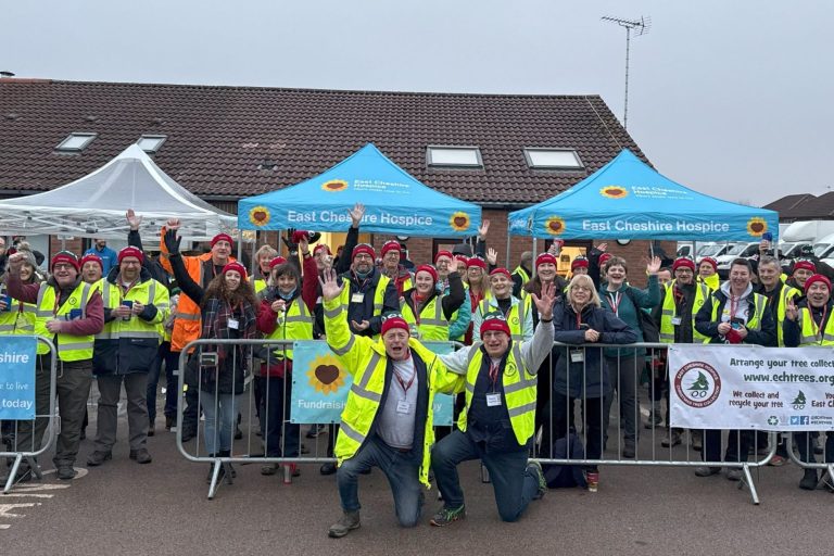 Big group of people in high vis jackets donating and recycling trees