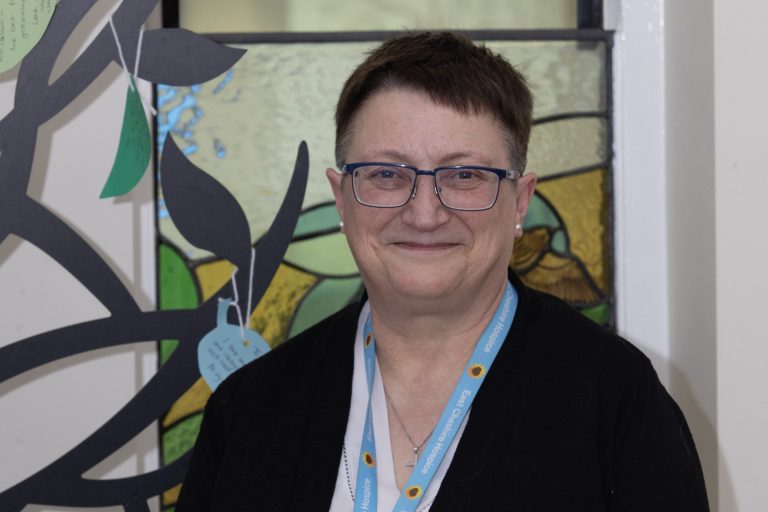 Photo of Hospice Chaplain Marion smiling at the camera