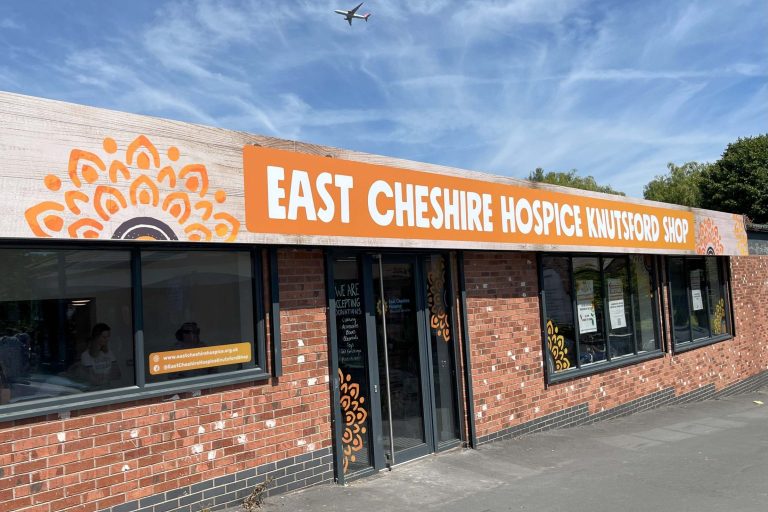 Photo of the front of East Cheshire Hospice's Knutsford shop featuring bright orange branding and signage