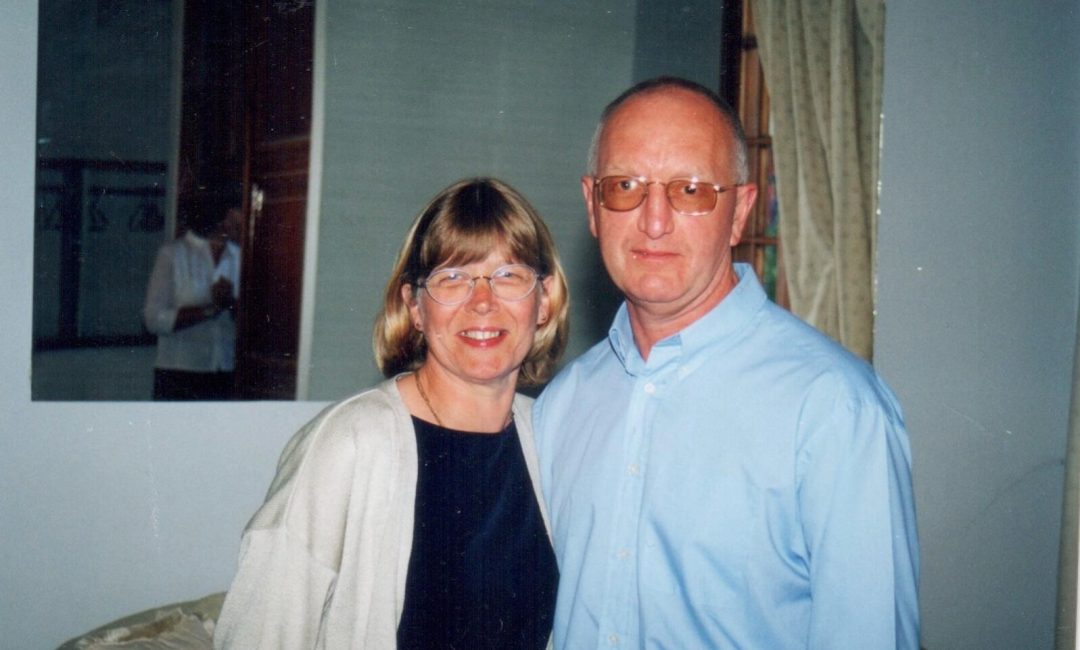 Alan and Maureen 'mo' bailey photograph together, stood next to one another, smiling at the camera