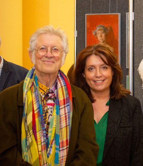 Photo of Noddy and Suzan Holder at Art Fair Cheshire smiling at the camera
